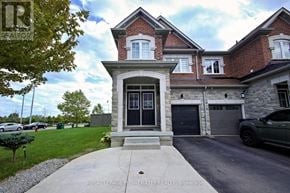 Brampton (Northwest Brampton) apartment for rent - A brick house with a black door and windows.
