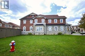 Brampton (Northwest Brampton) apartment for rent - A red fire hydrant is in front of a brick house.