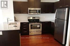 Mississauga (City Centre) condo for rent - A kitchen with a stove top oven and a refrigerator.