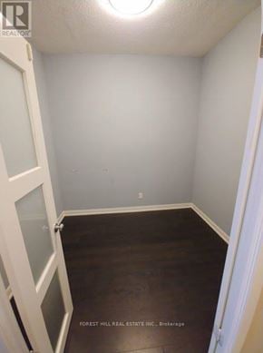 Toronto (Willowdale West) condo for rent - A small room with a door on the left and a window on the ceiling.