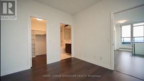 Toronto (Mount Pleasant West) condo for rent - A white room with a doorway leading to another room.