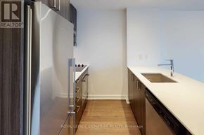 Toronto (Mount Pleasant West) condo for rent - A modern kitchen with a refrigerator and a sink.