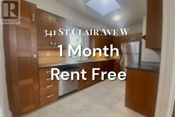 Toronto (Casa Loma) multi-family for rent - A sign advertising a 1 month rent free offer from Landlord Realty Inc.