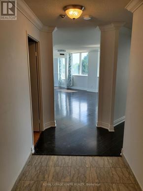 Toronto (Rouge) condo for rent - A hallway with a light on and a door at the end.