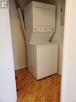 Toronto (Rouge) condo for rent - A white tankless water heater in a room.