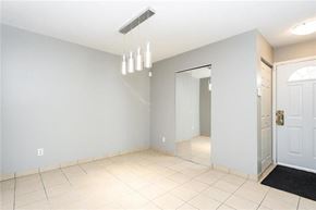 Winnipeg townhouse for rent - A room with a white door and a mirror on the wall.
