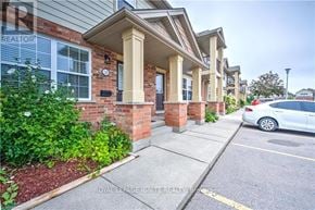 London South (South U) townhouse for rent - A white car is parked on the street in front of a building.