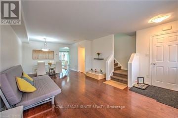 London South (South U) townhouse for rent - A living room with a grey couch and a yellow pillow.