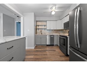 Chilliwack apartment for rent - A kitchen with a refrigerator on the right side.