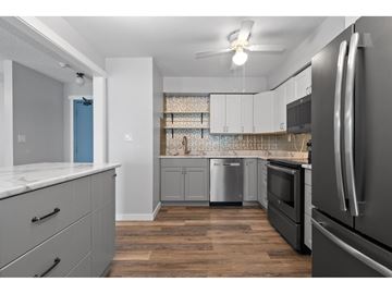 Chilliwack apartment for rent - A kitchen with a refrigerator on the right side.