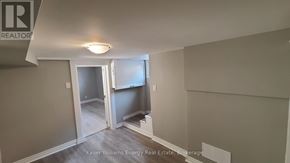 Oshawa (Central) apartment for rent - A room with a doorway leading to another room.