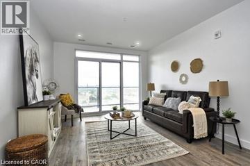 Cambridge condo for rent - A living room with a black couch and a coffee table.
