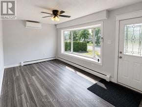 London East (East I) apartment for rent - A room with a ceiling fan and a door leading outside.