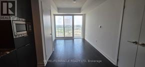 Toronto (Banbury-Don Mills) condo for rent - A hallway with a view of the city through the window.