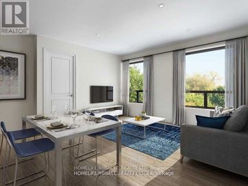 Brantford condo for rent - A well-lit living room with a dining table and a grey sofa.