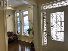 Aurora apartment for rent - A white door with a decorative iron grill is on the right side of the image.