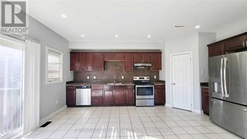 Brampton (Northwest Sandalwood Parkway) apartment for rent - A kitchen with a refrigerator, oven, and sink.