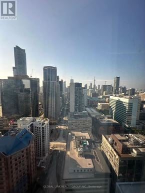 Toronto (Bay Street Corridor) condo for rent - A cityscape with tall buildings and a clear sky.