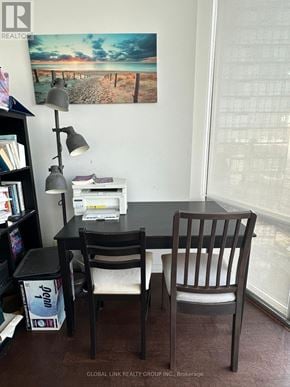 Toronto (Bay Street Corridor) condo for rent - A desk with a lamp and a chair in front of a window.