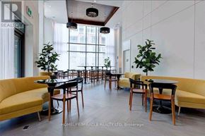 Toronto (Niagara) condo for rent - A well-lit dining area with tables and chairs.