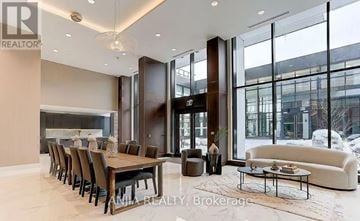 Toronto (Bayview Village) condo for rent - A well-lit, modern dining room with a large table and chairs.