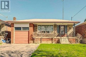 Toronto (Newtonbrook East) apartment for rent - A house with a red brick exterior and a grey roof.
