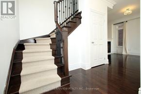 Markham (Cornell) apartment for rent - A staircase with a beige carpeted runner and a black metal railing.