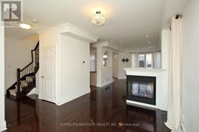 Markham (Cornell) apartment for rent - A living room with a fireplace and a staircase.
