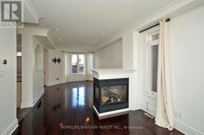 Markham (Cornell) apartment for rent - A large, well-lit living room with a fireplace and hardwood floors.