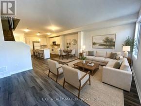 Russell townhouse for rent - A living room with a couch, chairs, and a coffee table.