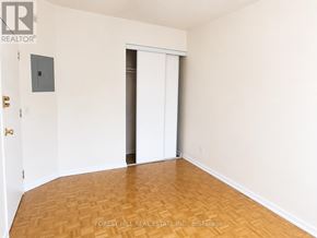 Toronto (Church-Yonge Corridor) condo for rent - A room with a wooden floor and a white door.