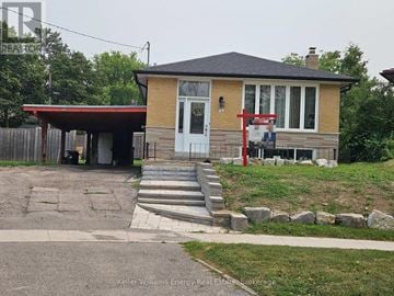 Toronto (Bendale) apartment for rent - A house with a red awning and a white door is shown.