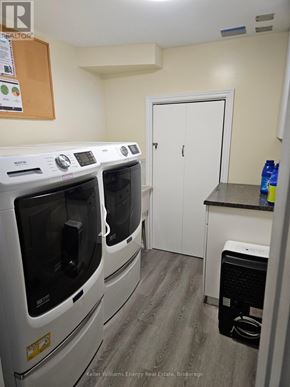 Toronto (Bendale) apartment for rent - A laundry room with a washer and dryer.