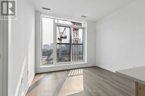 Toronto (Regent Park) condo for rent - A room with a view of a construction site through a window.
