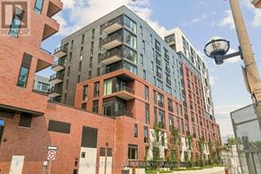 Toronto (Regent Park) condo for rent - A tall building with a no parking sign in front of it.