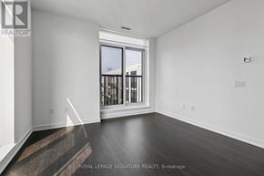 Toronto (Regent Park) condo for rent - A room with a window and wooden flooring.
