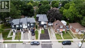Brantford apartment for rent - A bird's eye view of a neighborhood with houses and cars.