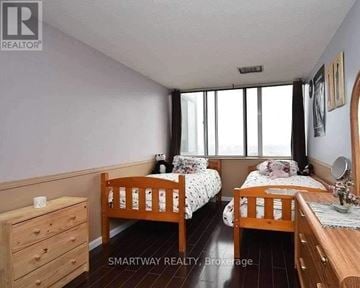 Mississauga (City Centre) condo for rent - A bedroom with two beds and a dresser.