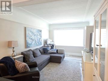 Hamilton (Westdale) apartment for rent - A living room with a grey couch and a painting on the wall.