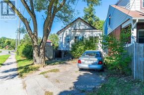 Toronto (Birchcliffe-Cliffside) apartment for rent - A car is parked in front of a white house.
