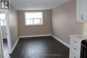Mississauga (Port Credit) multi-family for rent - A room with a window and a white cabinet.