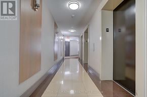 Toronto (York University Heights) condo for rent - A hallway with a light on the ceiling and doors on the right.