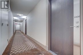 Toronto (York University Heights) condo for rent - A hallway with a rug on the floor and doors on either side.