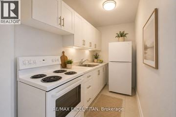 Toronto (Danforth Village-East York) condo for rent - A white kitchen with a stove top oven and a refrigerator.