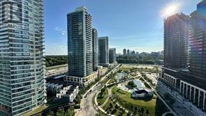 Toronto (Bayview Village) condo for rent - A cityscape with tall buildings and a clear sky.