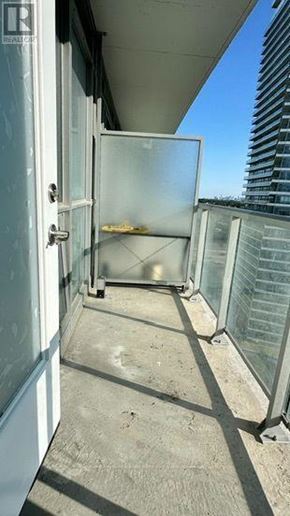 Toronto (Bayview Village) condo for rent - A balcony with a glass door and a white door.