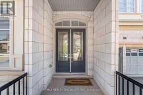 Oakville (Go Glenorchy) apartment for rent - The entrance to a building with a black door and a welcome mat.