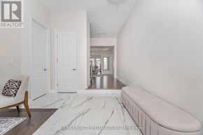 Oakville (Go Glenorchy) apartment for rent - A white hallway with a bench and a chair.