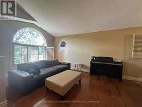 Hamilton (Mountview) apartment for rent - A living room with a piano and a couch.