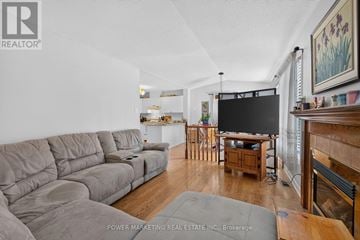 Ottawa apartment for rent - A living room with a grey sofa and a television.